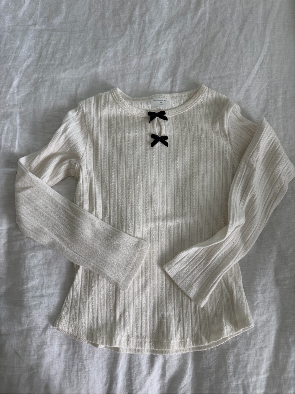 Girls' Cream Ribbed Long-Sleeve Top with Black Bow Detail
